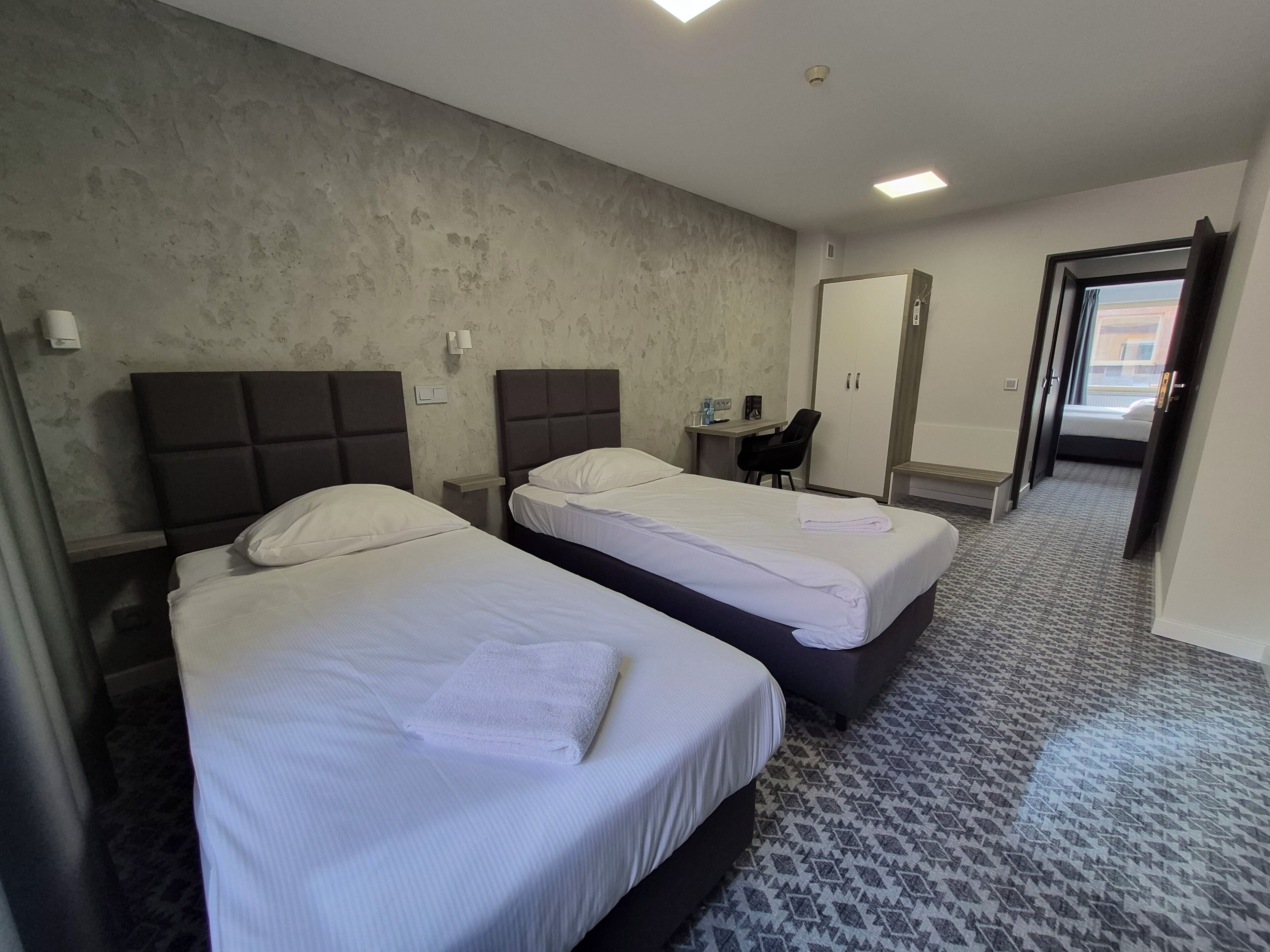 Family Room | Premium bedding, desk, laptop workspace, free WiFi