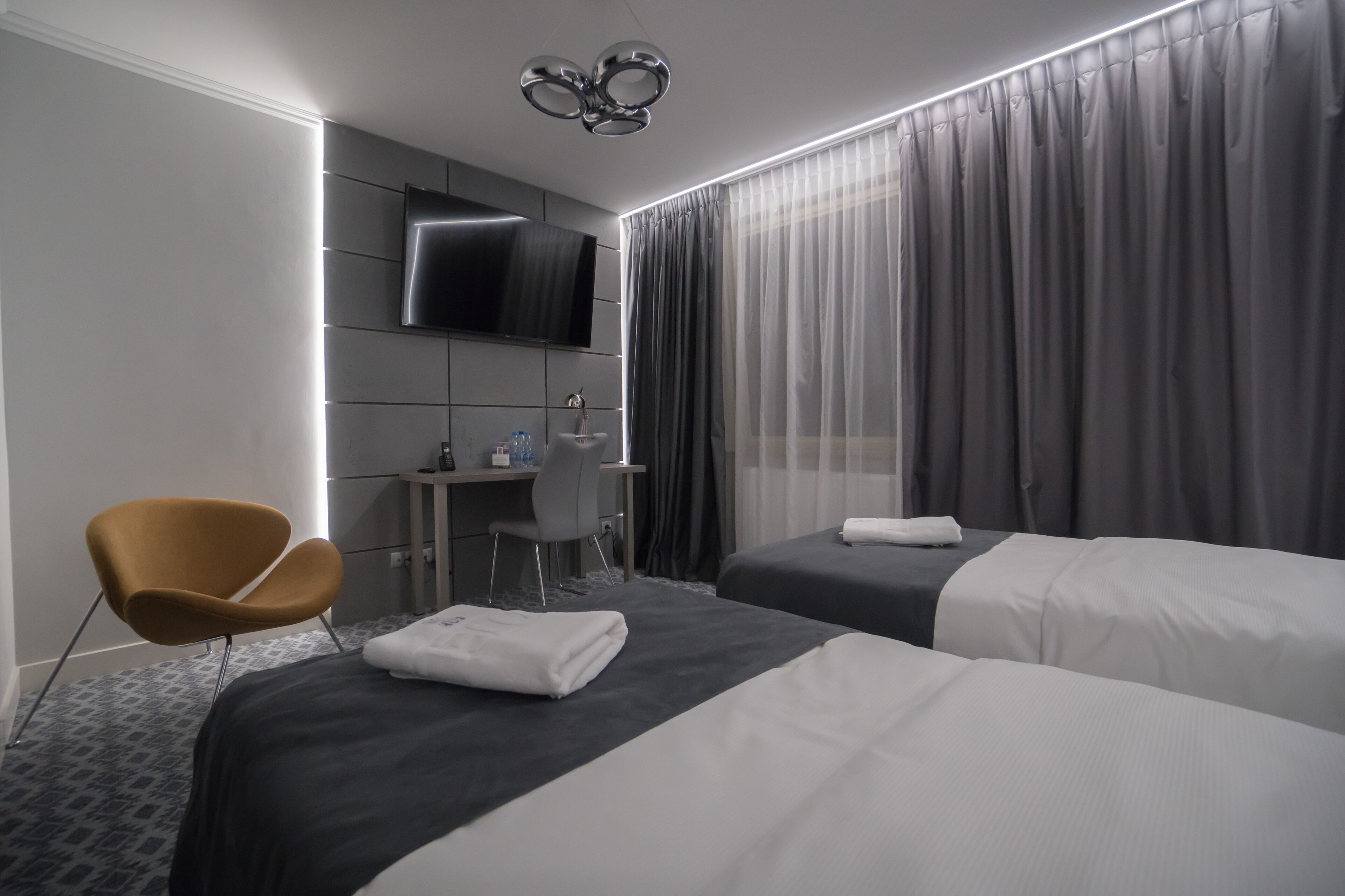 executive triple room | living area | flat-screen tv, pay films, mp3 dock