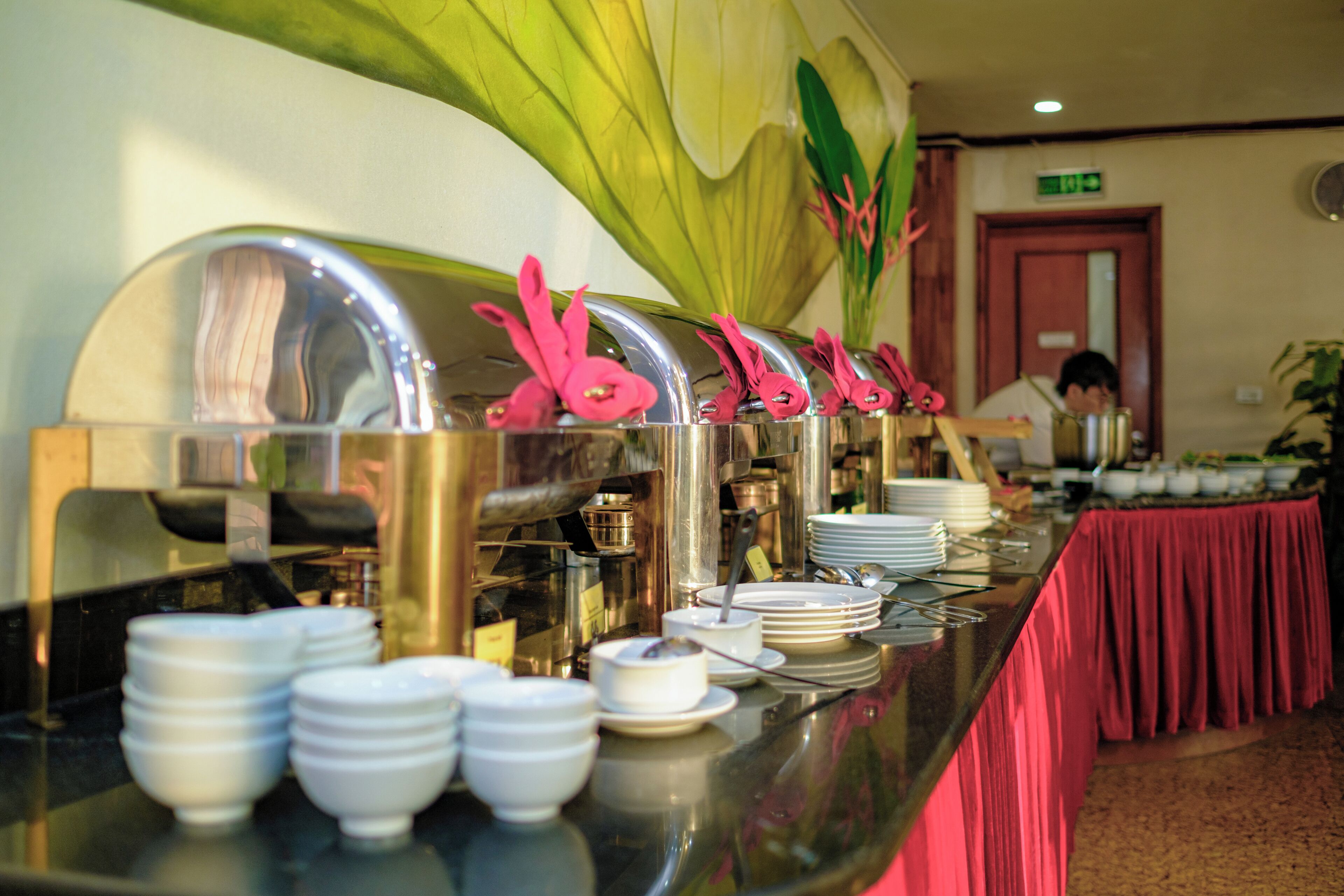 A buffet setup with multiple food stations and a variety of dishes.