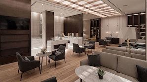 A modern interior with a central seating area, a kitchen, and a dining space. - Sono Calm Goyang (Goyang)