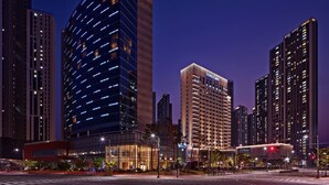 A modern hotel with a glass facade, multiple floors, and a prominent 'SONO' sign. - Sono Calm Goyang (Goyang)