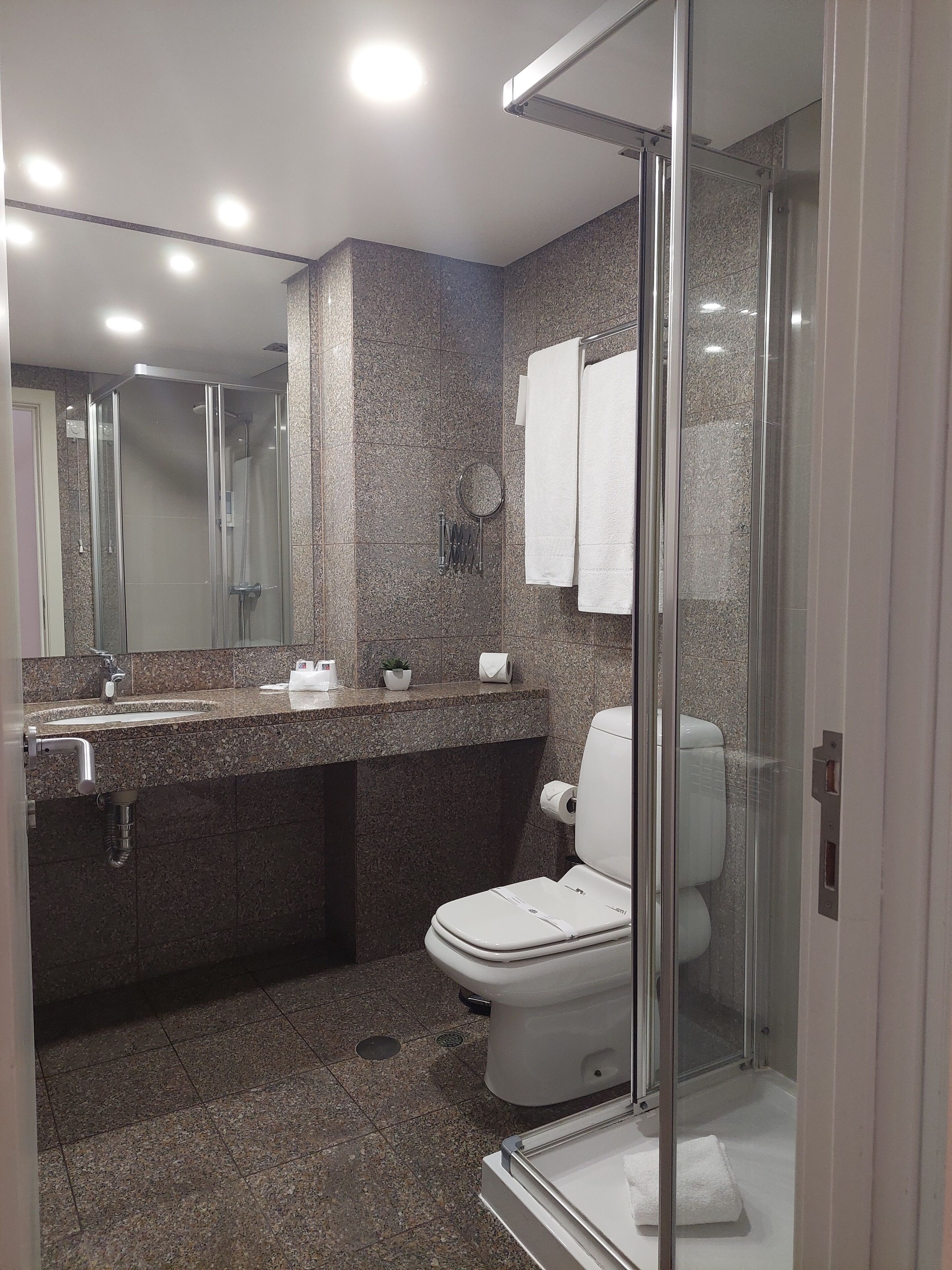 shower, free toiletries, hair dryer, towels