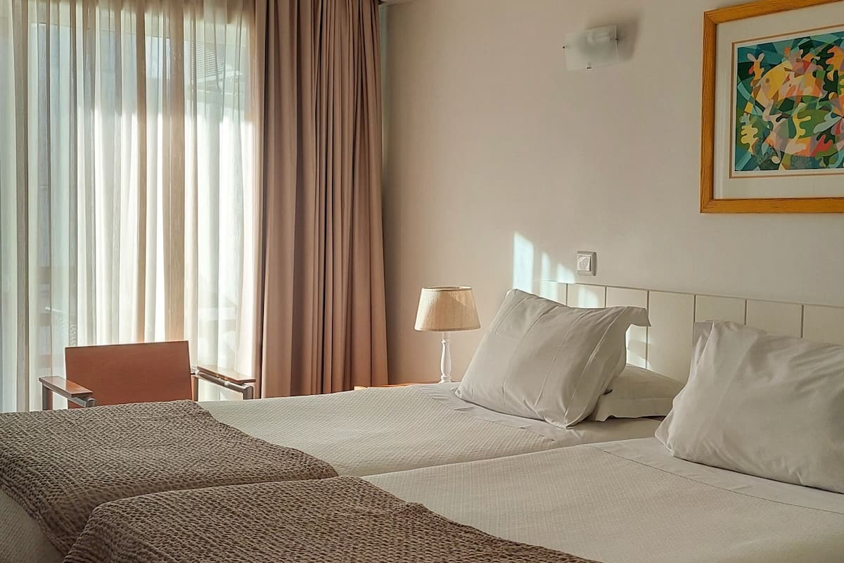 standard twin room | in-room safe, desk, iron/ironing board, free wifi