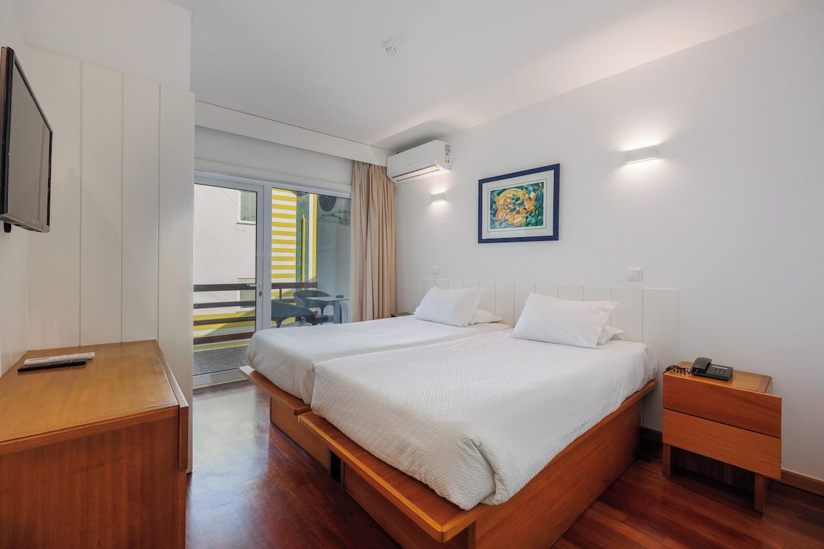 standard twin room | in-room safe, desk, iron/ironing board, free wifi