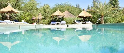 Outdoor pool, pool umbrellas, sun loungers
