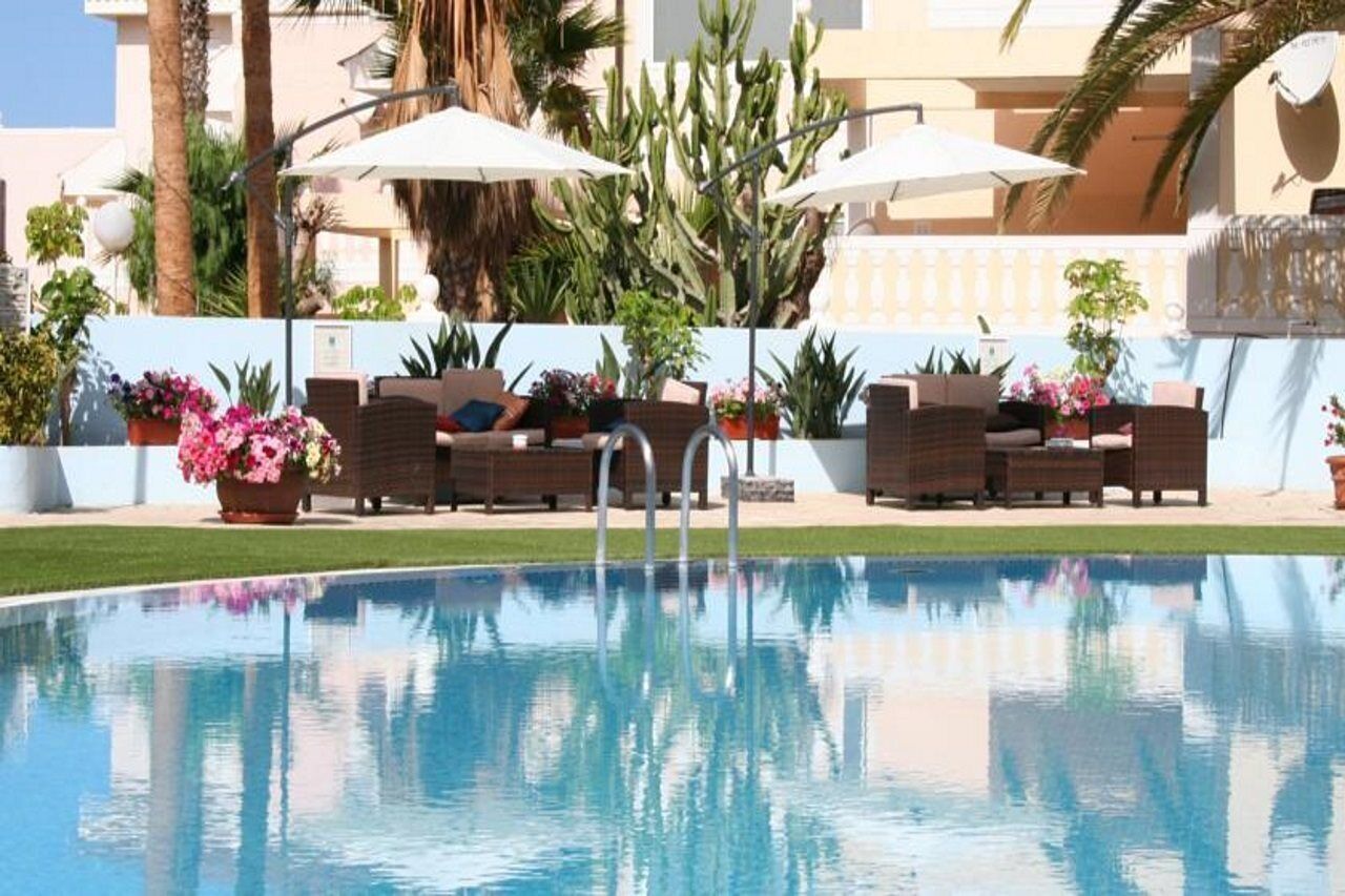 Outdoor pool, pool umbrellas, pool loungers