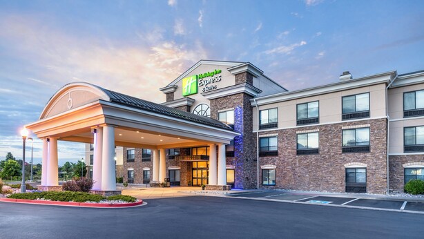 A Holiday Inn Express hotel with a covered entrance, brick facade, and multiple windows. - Holiday Inn Express & Suites Colorado Springs First & Main by IHG (Colorado Springs)