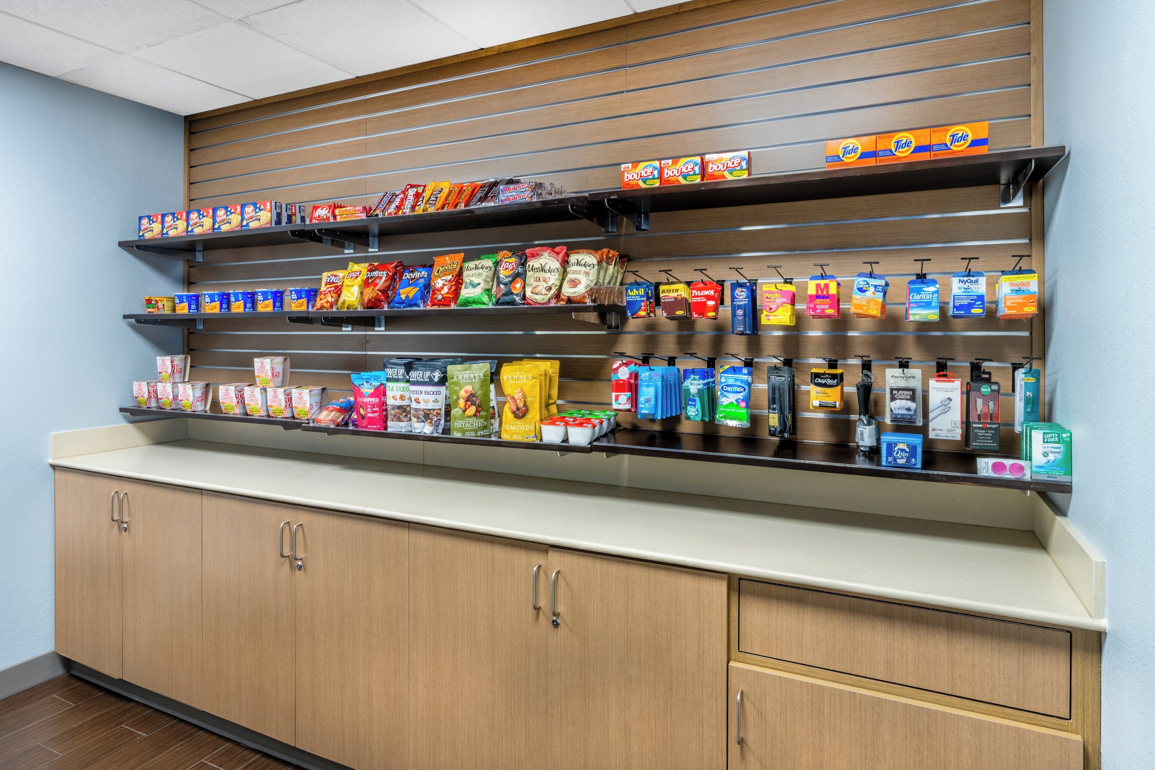 A self-service beverage station with various drink options and snacks.