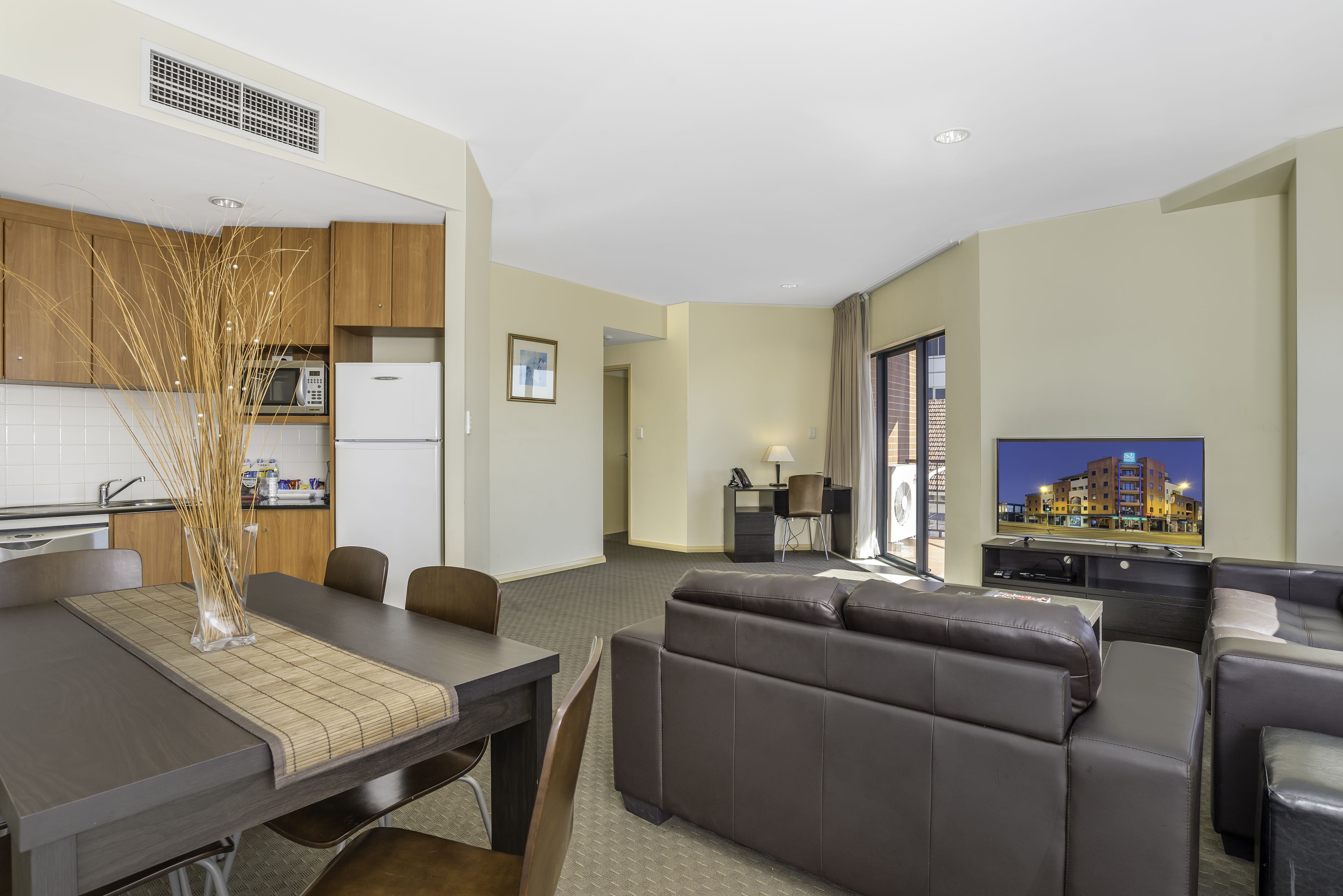 Apartment, 2 Bedrooms | Living area | 50-inch LCD TV with cable channels, TV, DVD player