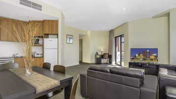 Apartment, 2 Bedrooms | Living area | 50-inch LCD TV with cable channels, TV, DVD player
