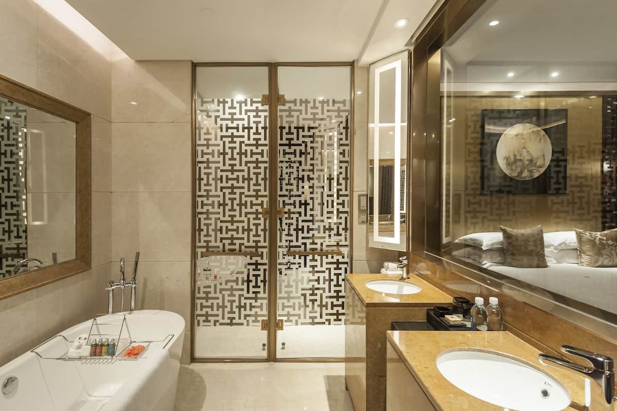 separate bathtub and shower, deep-soaking bathtub, rainfall showerhead