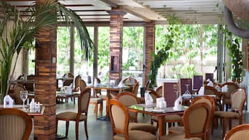 Breakfast, lunch served; international cuisine, al fresco dining 