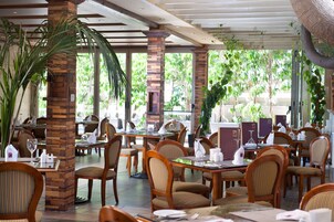 Breakfast, lunch served; international cuisine, al fresco dining 