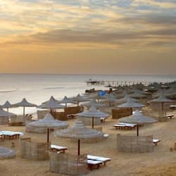 On the beach, sun-loungers, beach umbrellas, beach towels