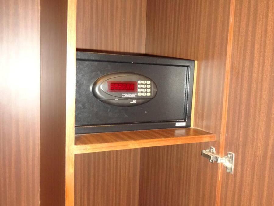 A wooden cabinet with a digital lock.