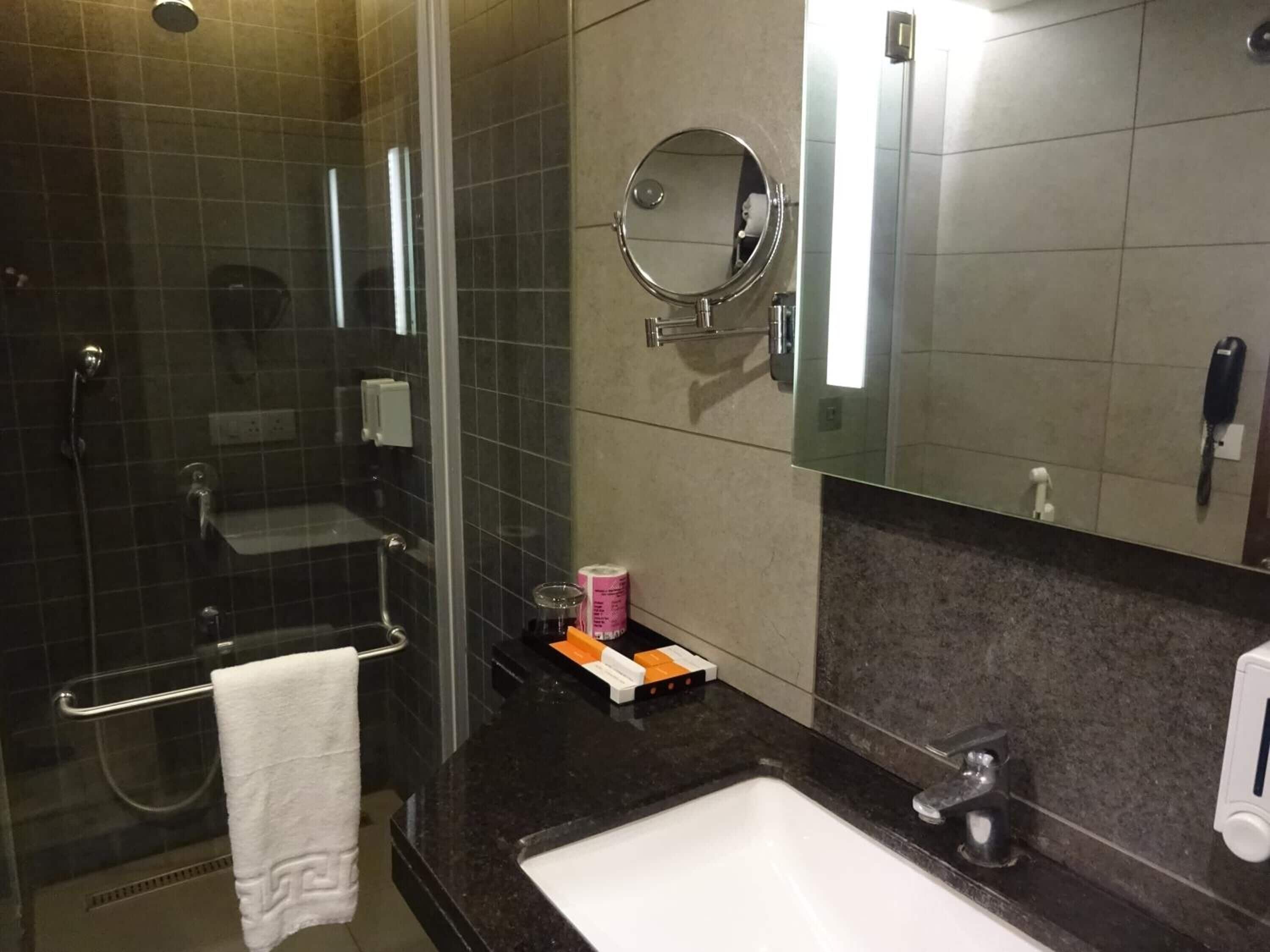 bathtub, free toiletries, hair dryer, slippers