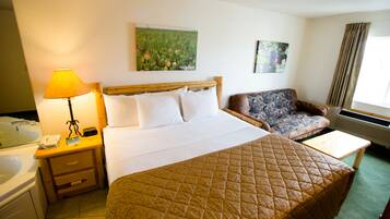 Grand Suite, 1 King Bed, Jetted Tub (2 Futons also in room) | Desk, iron/ironing board, cribs/infant beds, free WiFi
