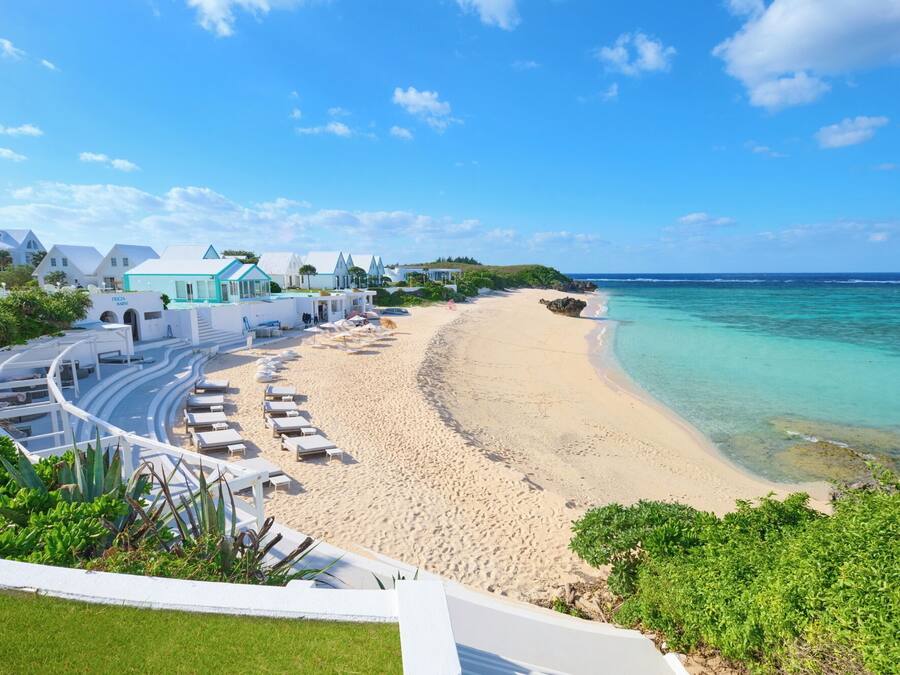 On the beach, white sand, beach umbrellas, beach towels