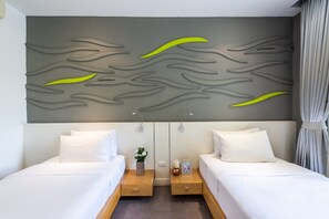 Habitación Deluxe | Ropa de cama de alta calidad y minibar 