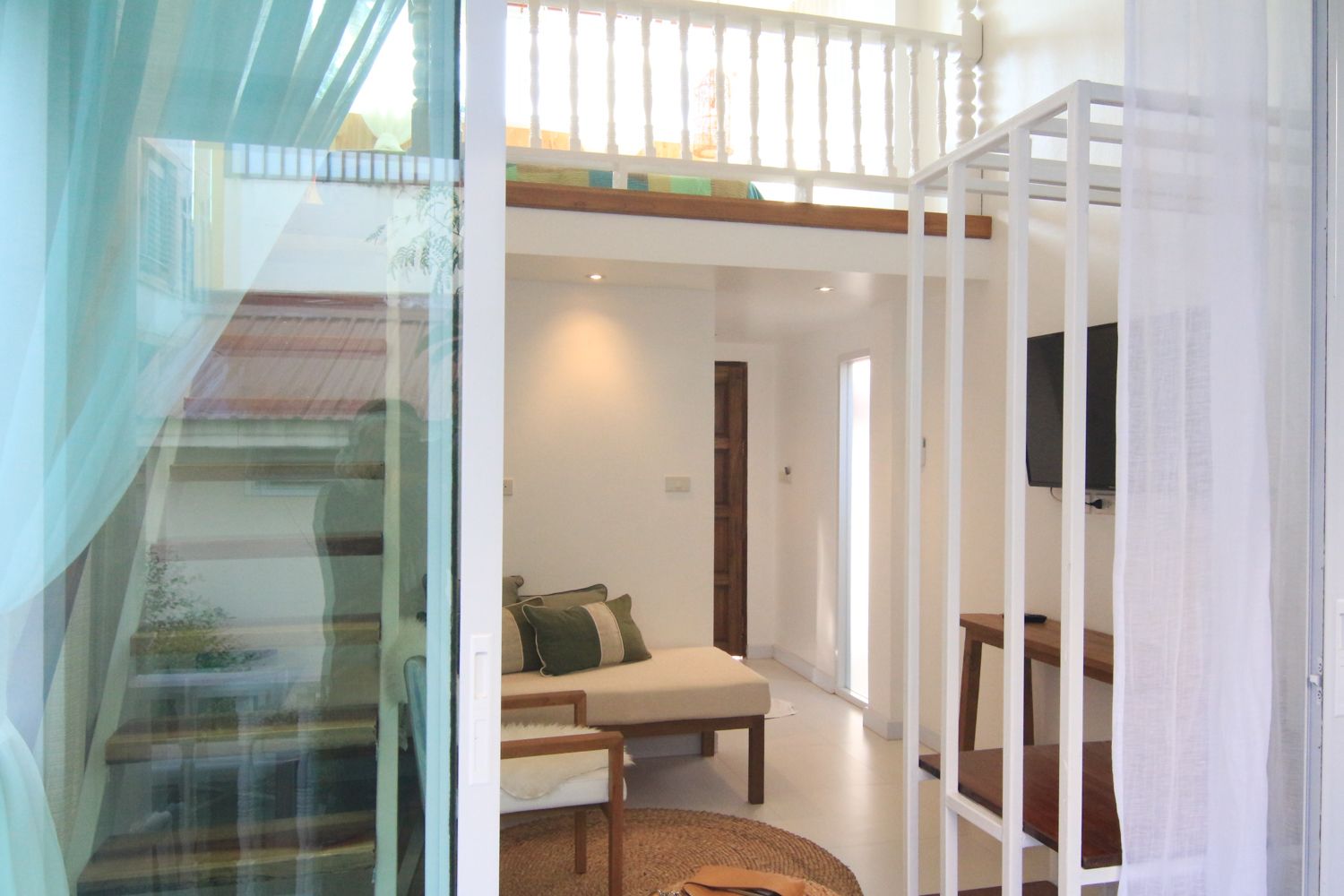 family garden view with balcony | living area | tv