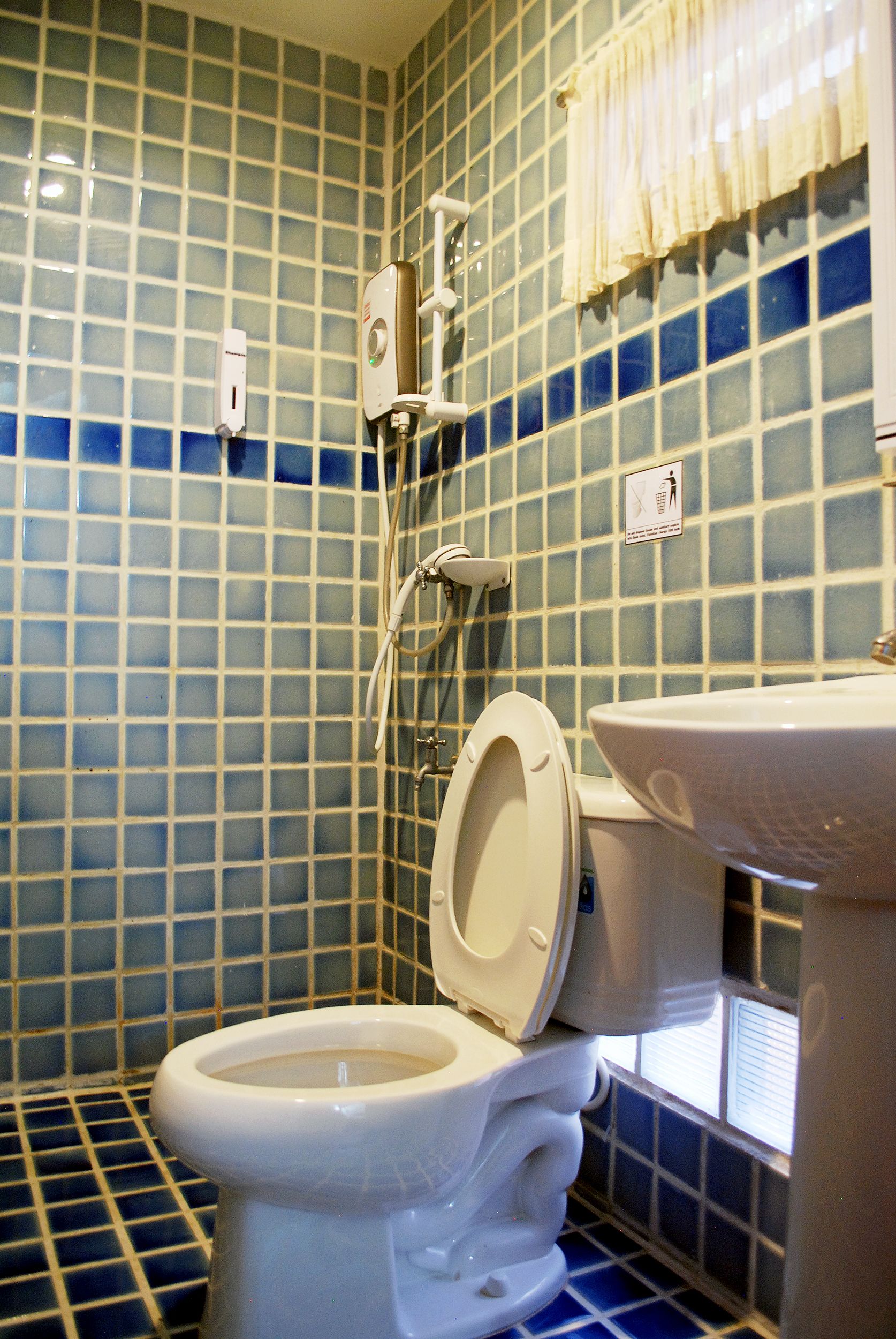 standard twin bed | bathroom | free toiletries, hair dryer, slippers, towels