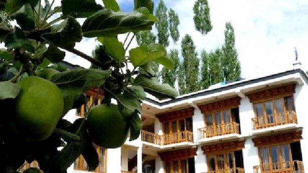 A multi-story building with balconies and windows. - TIH Hotel Kidar, Leh (Leh)