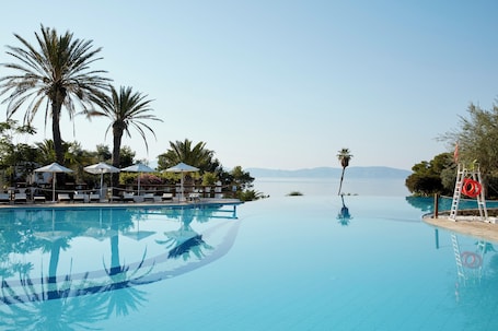 Indoor pool, outdoor pool, open 10:00 AM to 6:00 PM, pool umbrellas