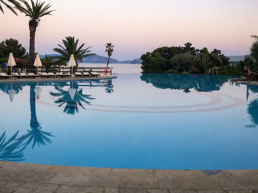 Indoor pool, outdoor pool, open 10:00 AM to 6:00 PM, pool umbrellas