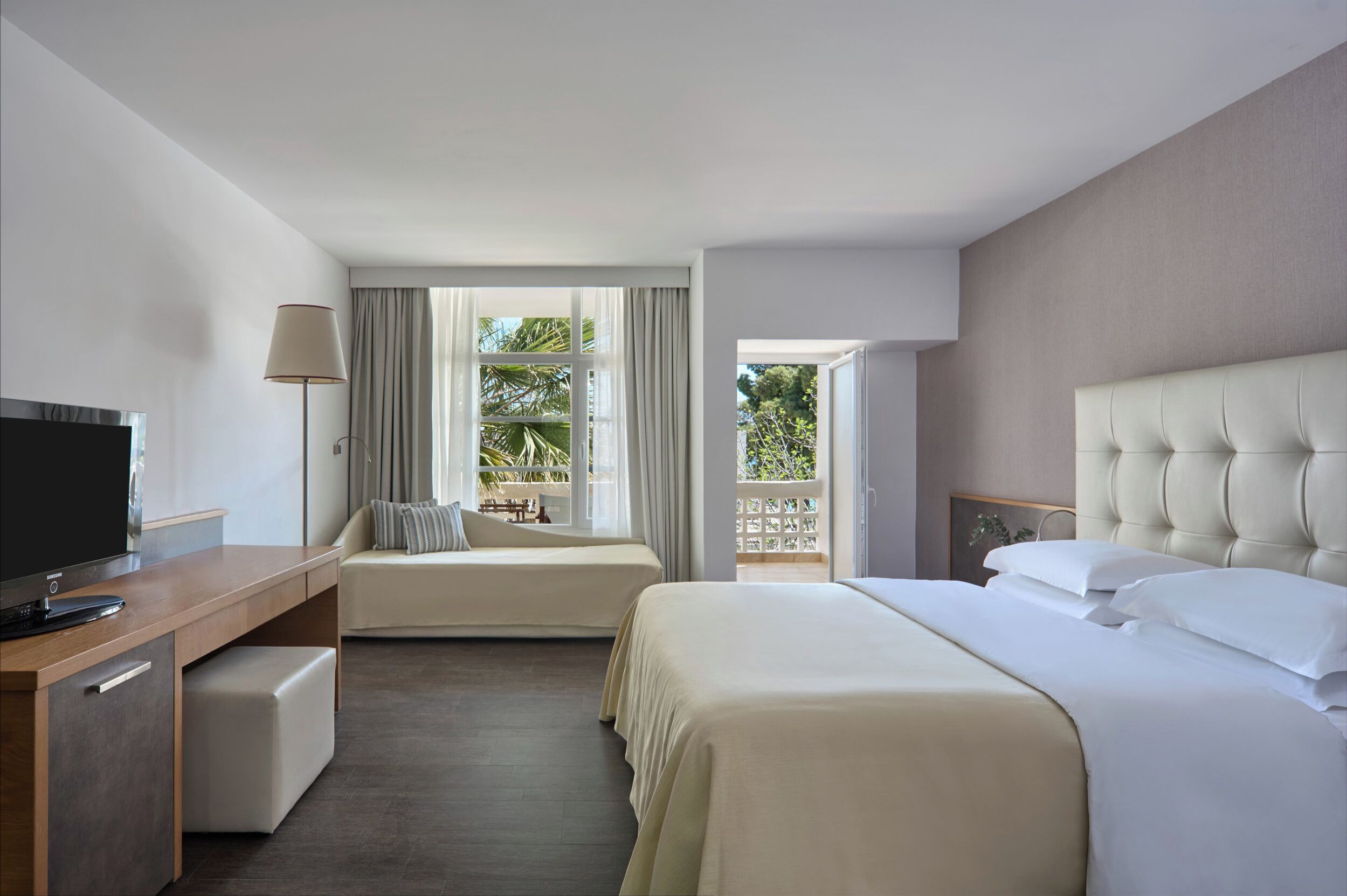 Deluxe Plus with Garden View | Minibar, in-room safe, individually decorated, desk