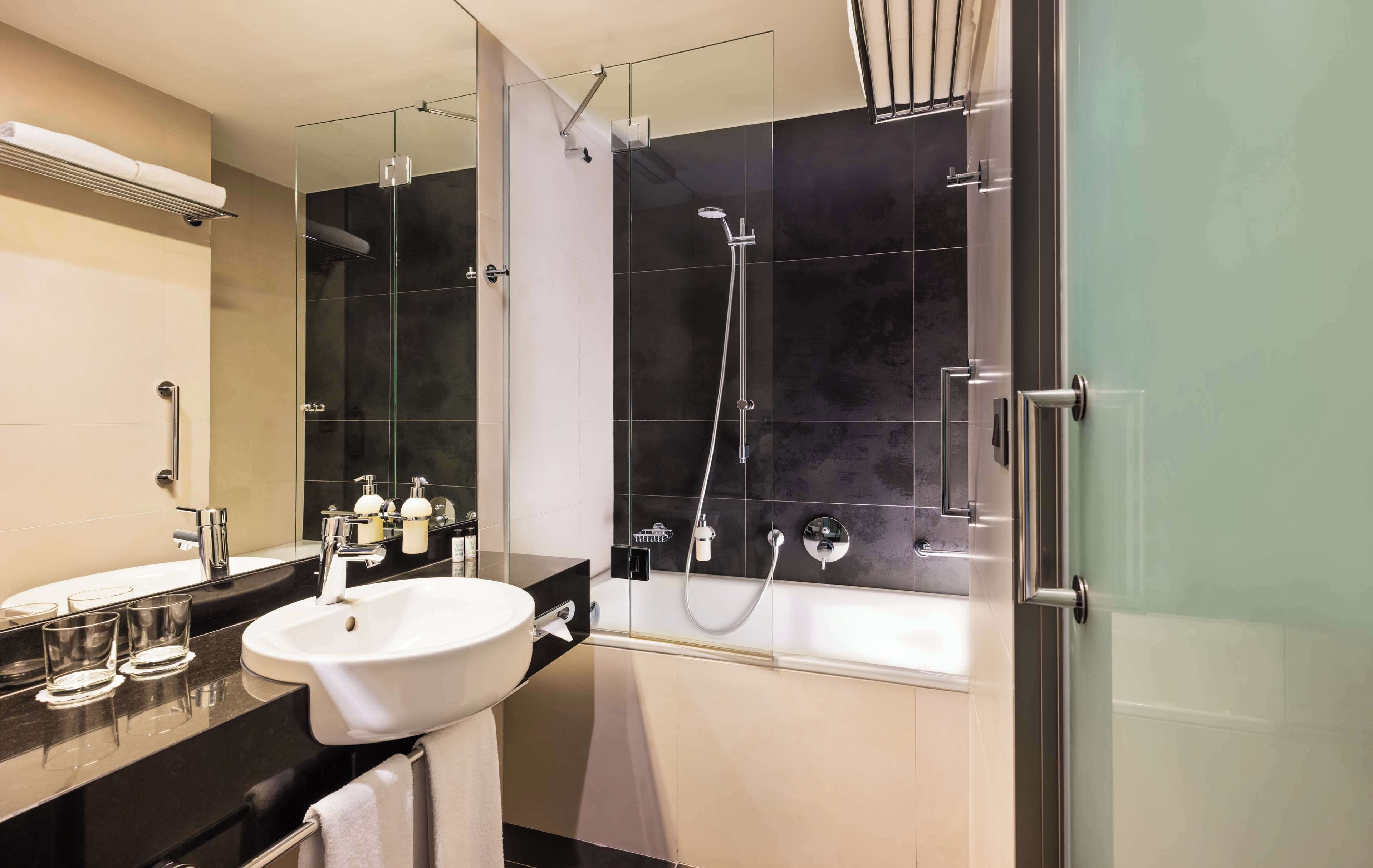 junior suite | bathroom | eco-friendly toiletries, hair dryer, towels, soap