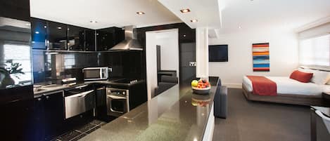 Deluxe Suite with Pool View & Kitchen | Private kitchen | Fridge, coffee/tea maker, electric kettle