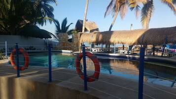 Outdoor pool, open 9 AM to 9 PM, pool loungers