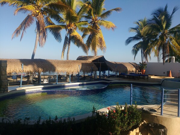 Outdoor pool, open 9 AM to 9 PM, pool loungers