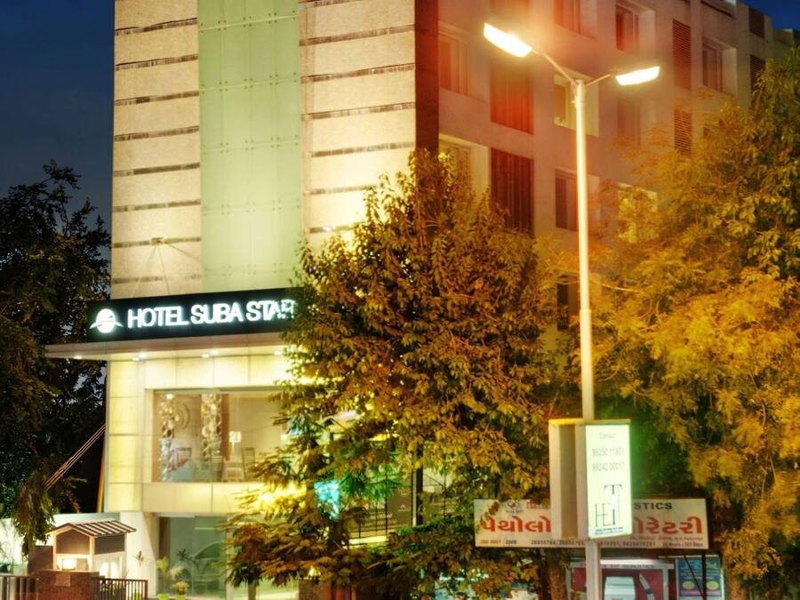 A multi-story hotel with a prominent sign reading "HOTEL SUBA STAR".