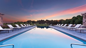 A swimming pool with lounge chairs and a sunset view. - Salamander Resort And Spa (Middleburg)