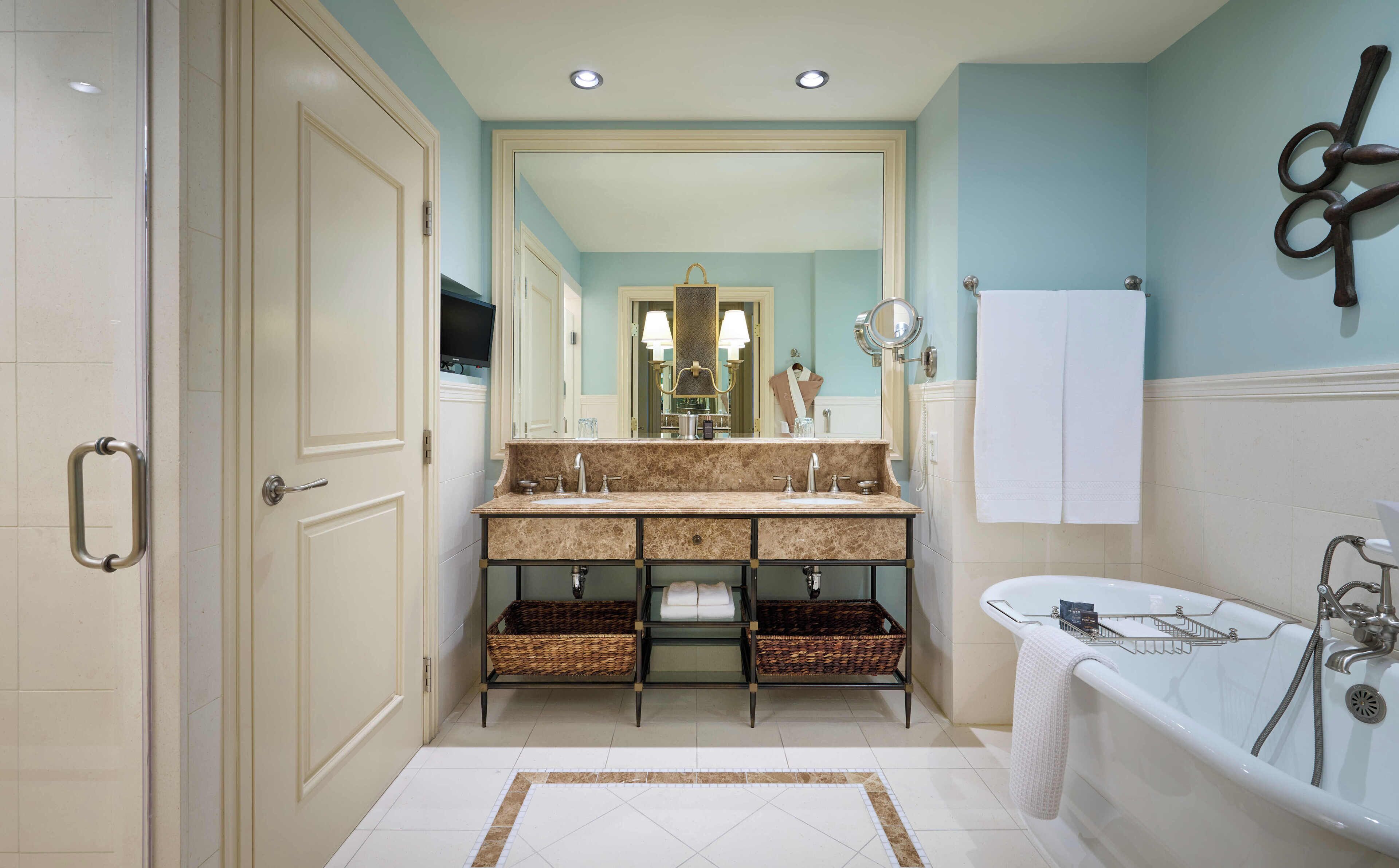 designer toiletries, hair dryer, bathrobes, slippers