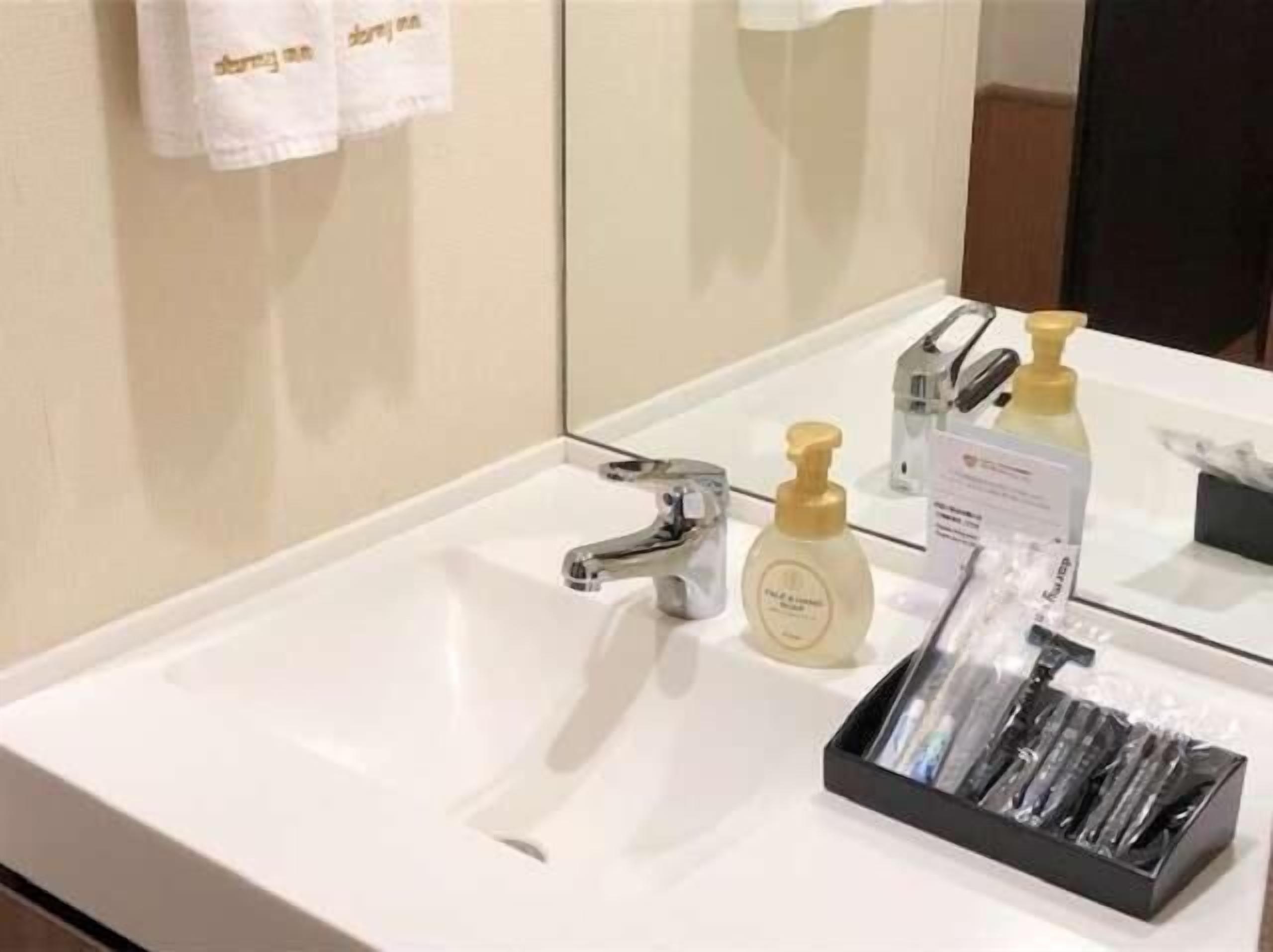 shower, rainfall showerhead, hair dryer, slippers