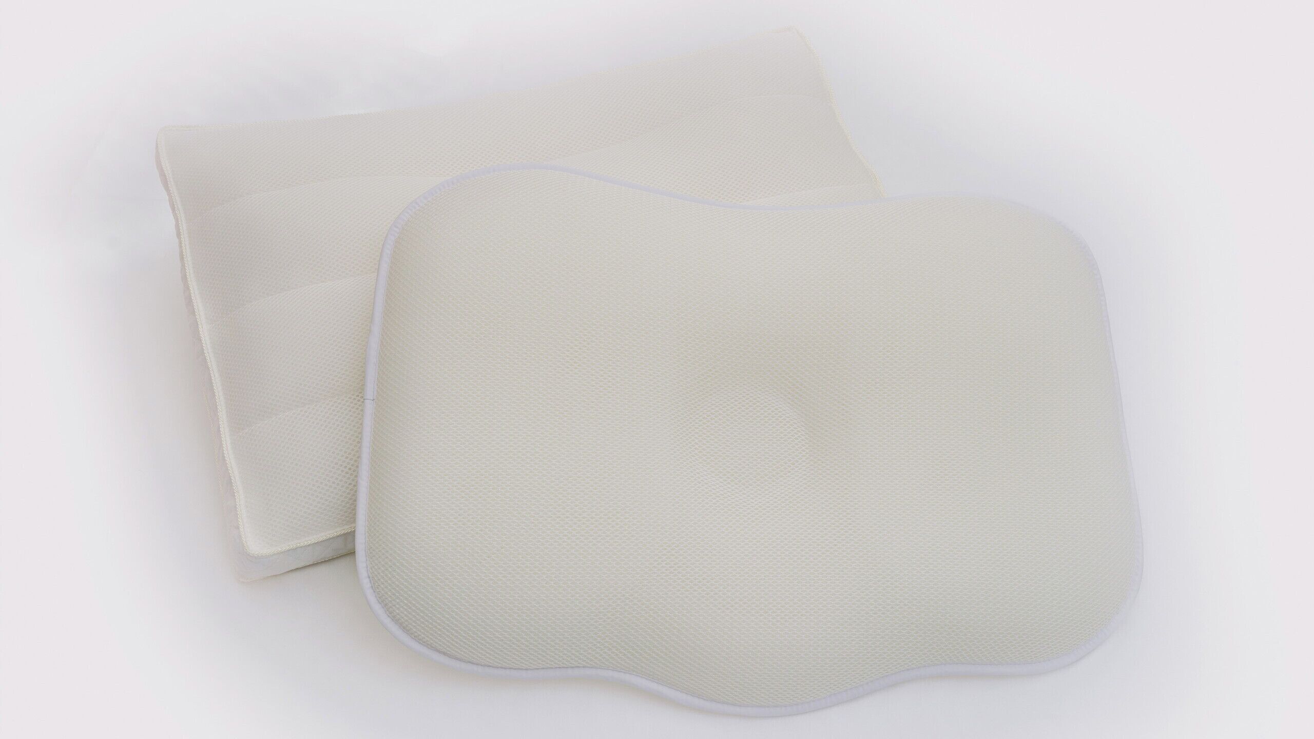 Dos objectes blancs, rectangulars, amb vores arrodonides i una superfície rugosa.