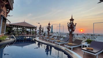 Indoor pool, outdoor pool, pool umbrellas, pool loungers