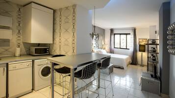 Deluxe Studio | Down comforters, memory foam beds, individually decorated