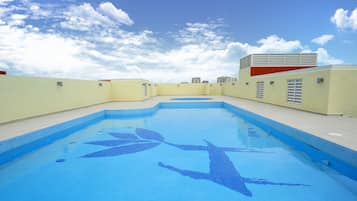 Outdoor pool, open 7:00 AM to 7:00 PM, pool umbrellas, pool loungers