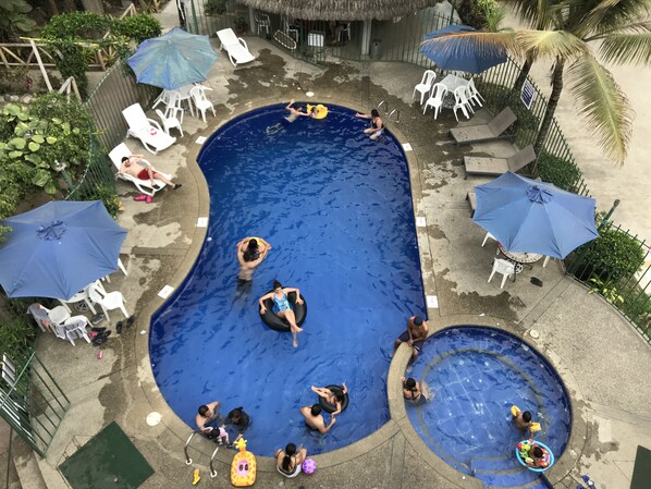 Outdoor pool, free pool cabanas, pool umbrellas