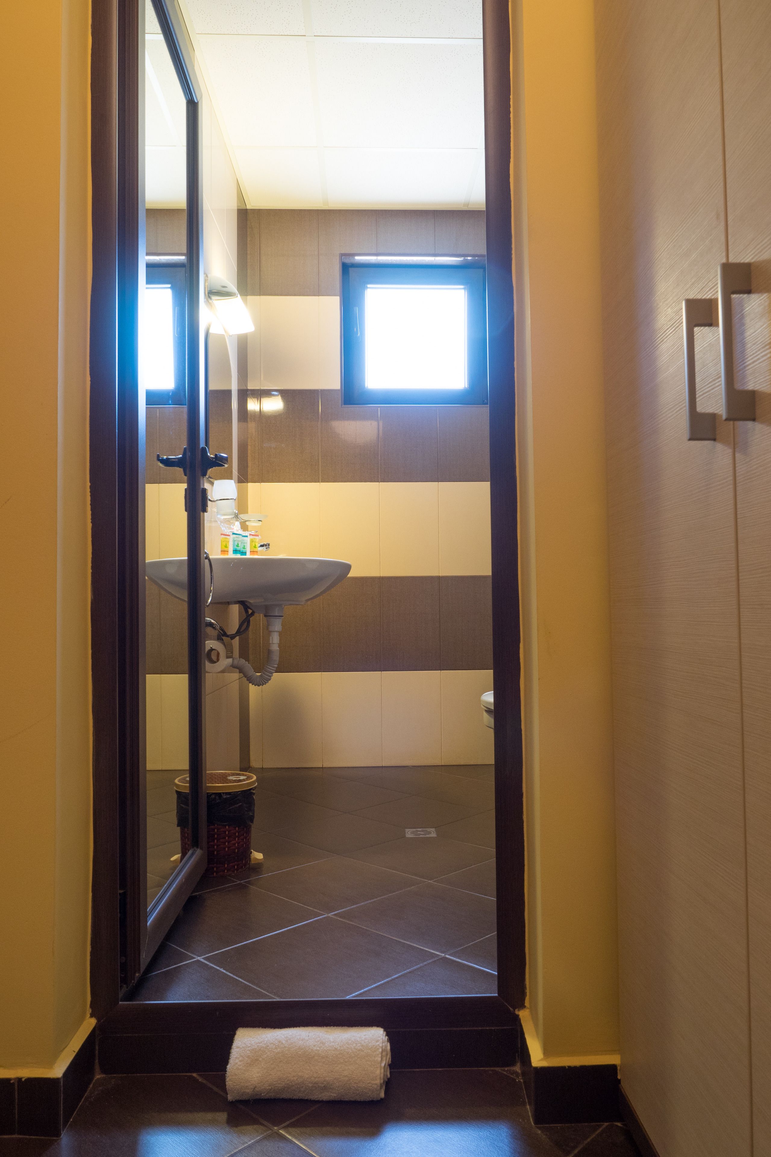 shower, free toiletries, slippers, towels