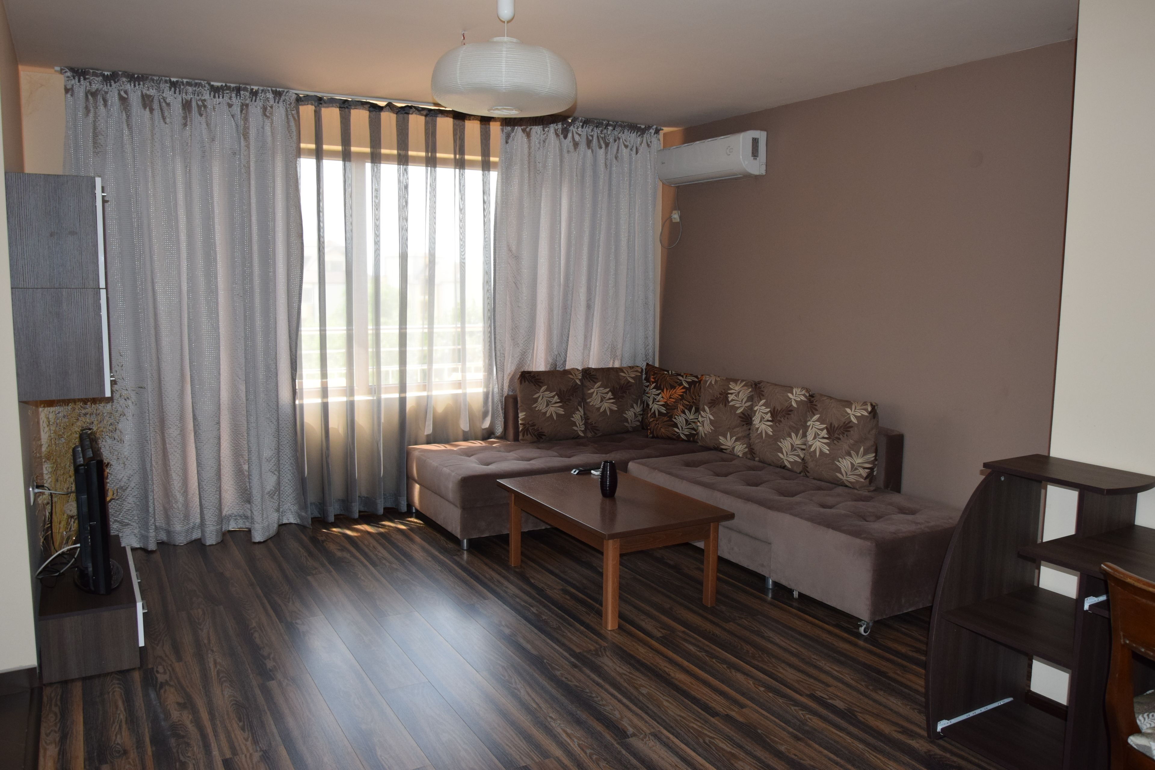 deluxe apartment | living area | flat-screen tv