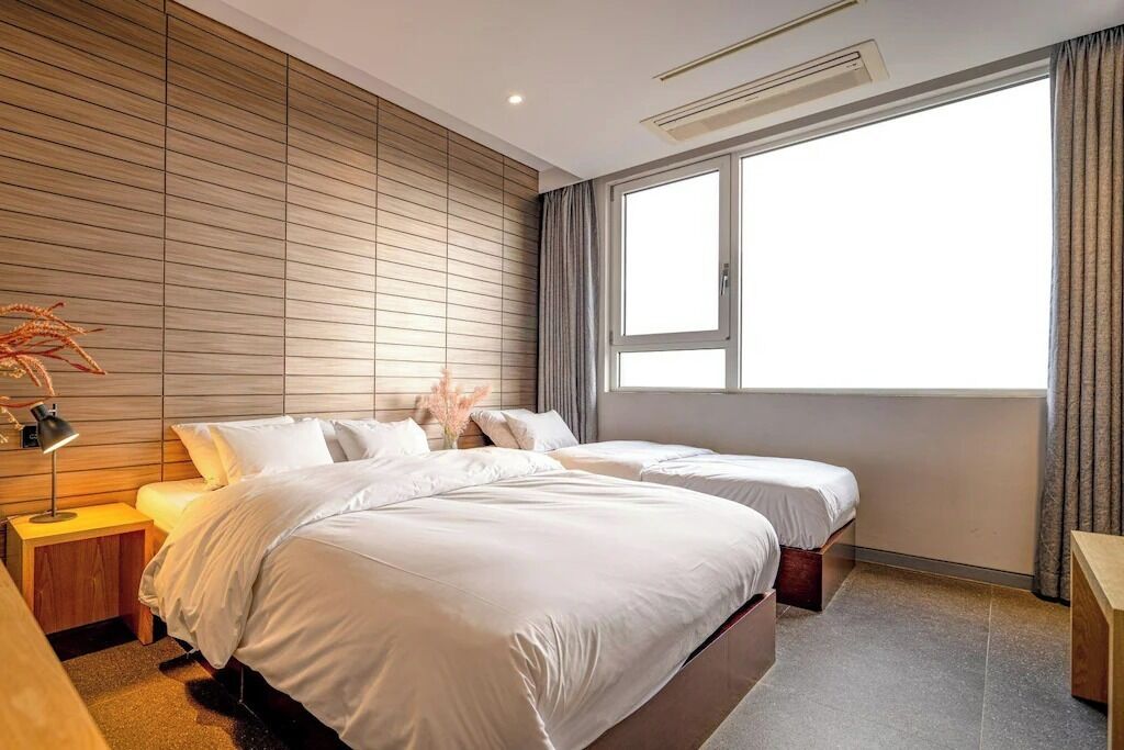 Semi Suite Family | Memory foam beds, individually decorated, desk, blackout drapes