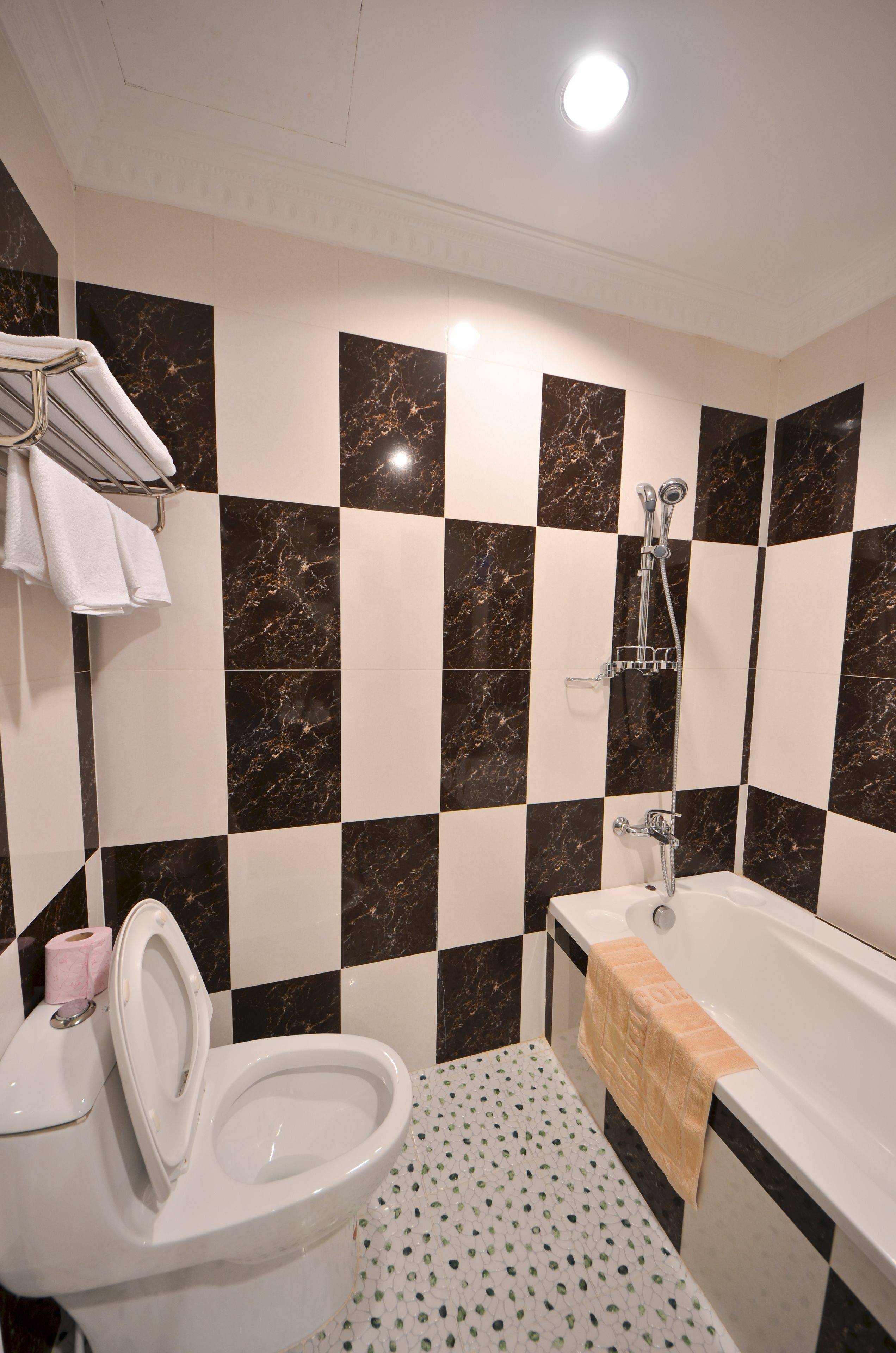 combined shower/bathtub, designer toiletries, hair dryer, bathrobes