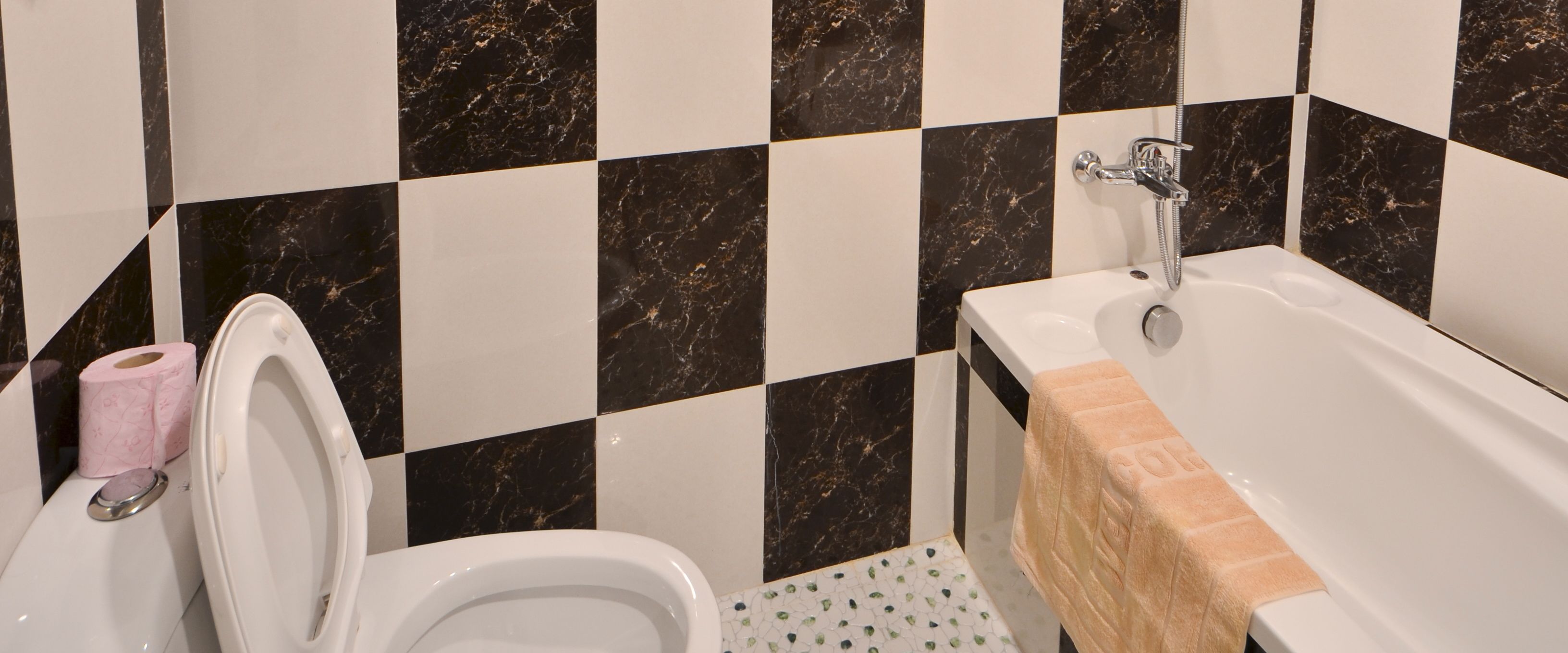 combined shower/bathtub, designer toiletries, hair dryer, bathrobes