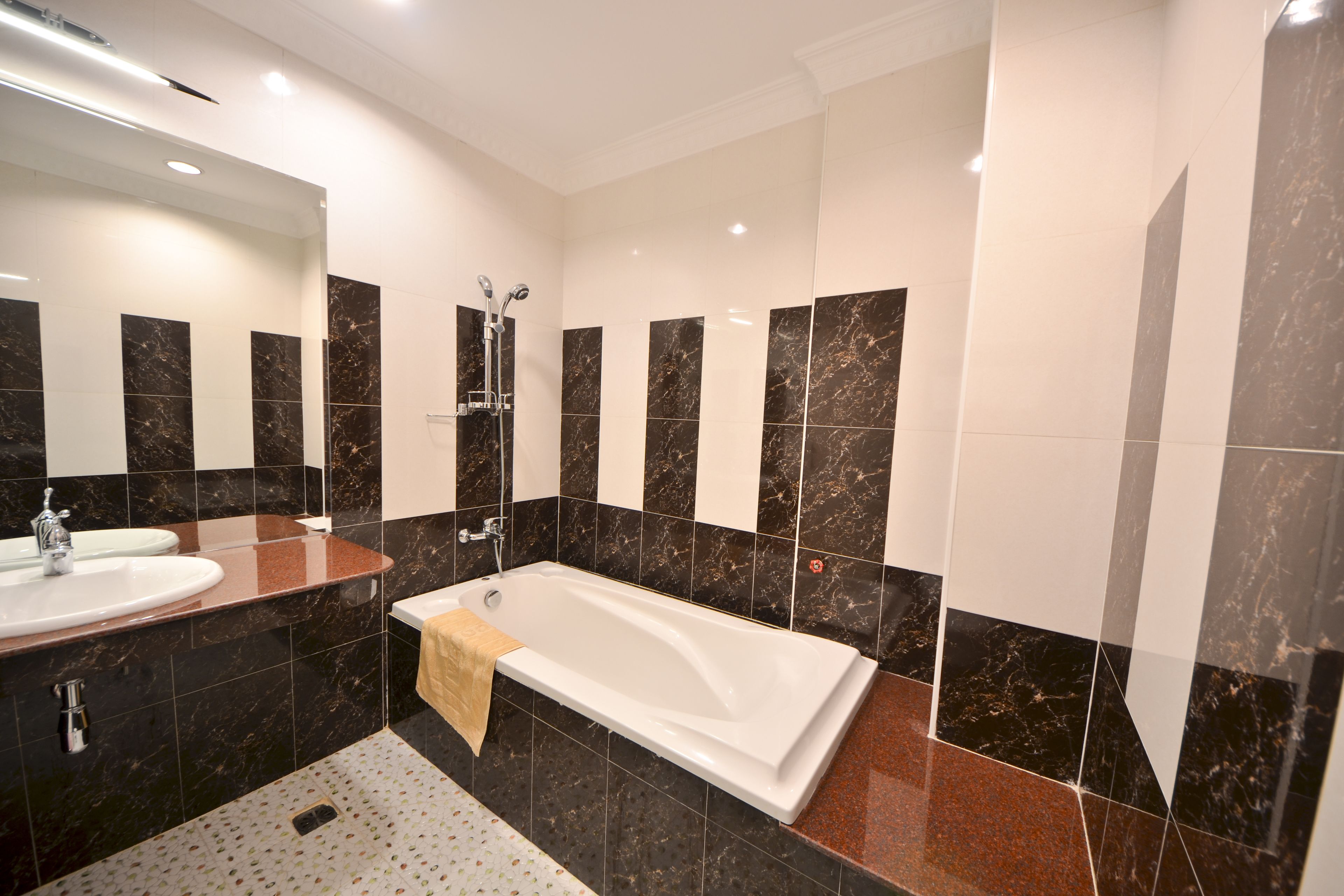 combined shower/bathtub, designer toiletries, hair dryer, bathrobes