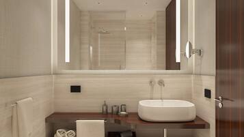 A modern bathroom with a large mirror, two sinks, a bathtub, and a vanity with storage.