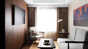 One-Bedroom Suite | Area soggiorno | TV LED 42 pollici con canali via cavo, TV, lettore DVD